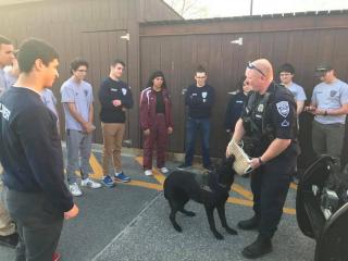 K9 Officer Berthelette giving a demonstration to the explorers with K9 Aspen
